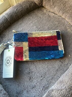 Kipling Multicolor Reversible Sequin Wristlet in Red, Blue & Gold